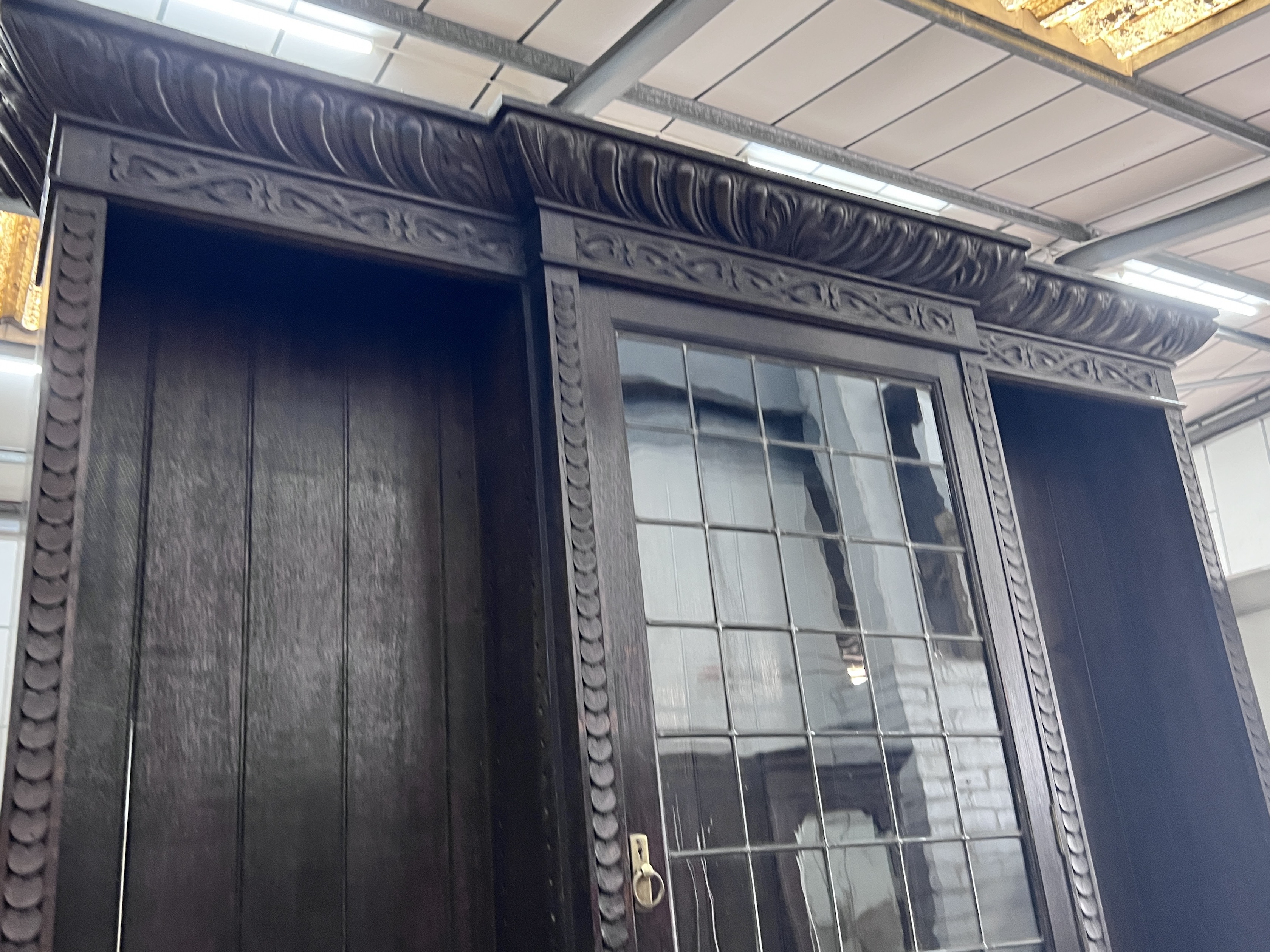 An early 20th century carved oak breakfront library bookcase, width 206cm, depth 54cm, height 260cm